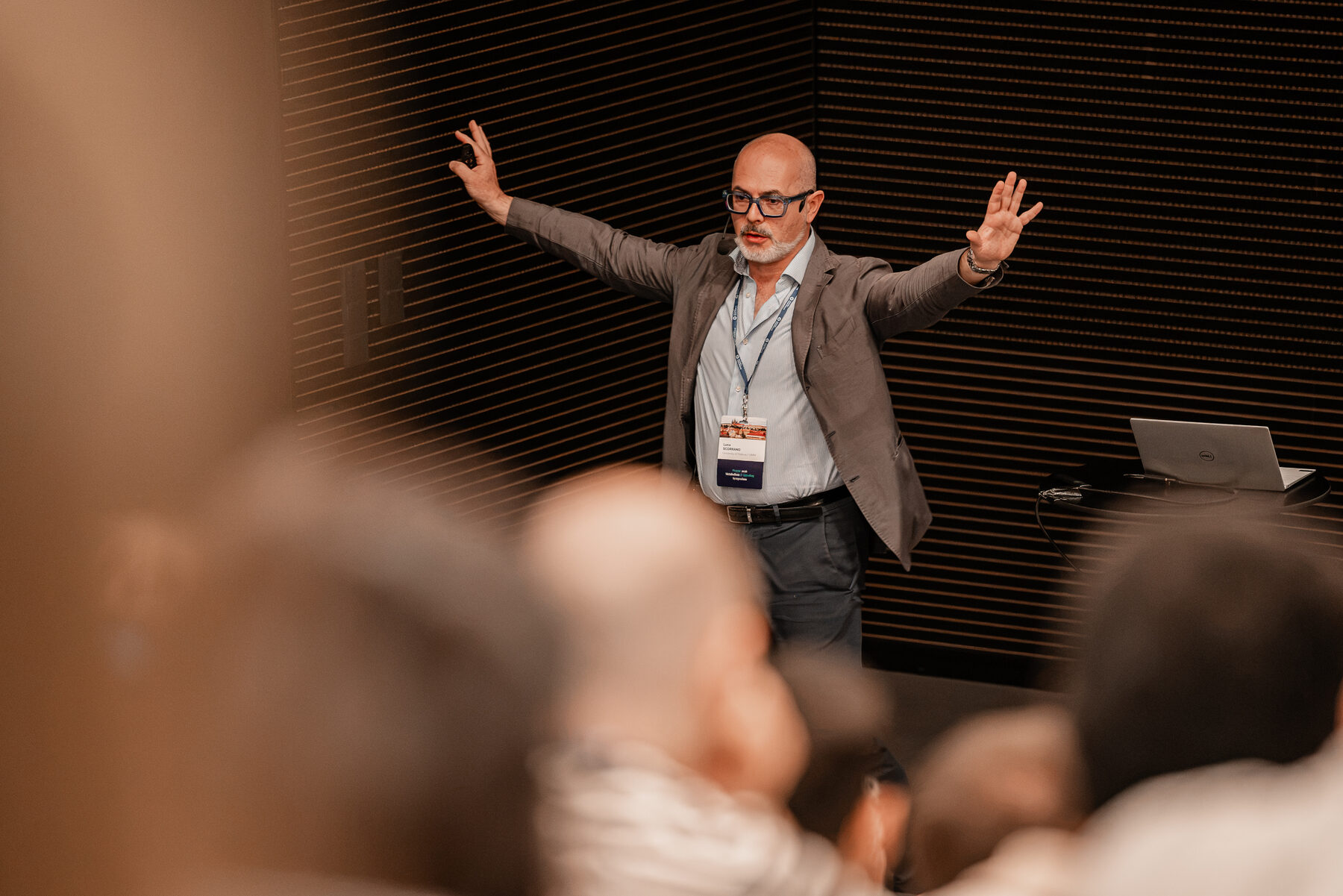 Luca Scorrano presenting at the symposium